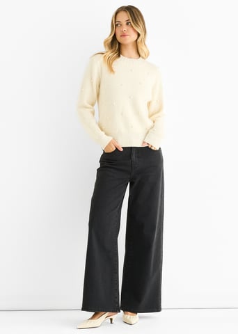 Jersey de punto de cuello alto con perlas crema