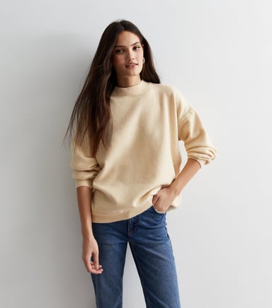 Jersey de punto fino color crema