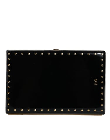 Bolso de mano de cuero negro con tachuelas y marco dorado