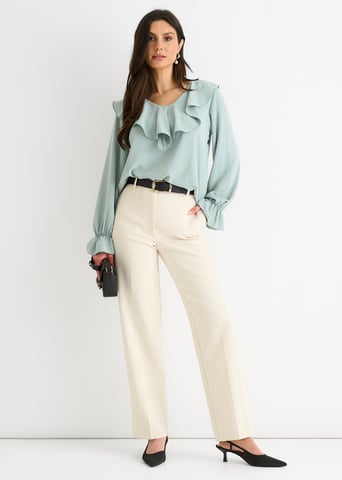 Blusa holgada con volantes anchos en color verde salvia