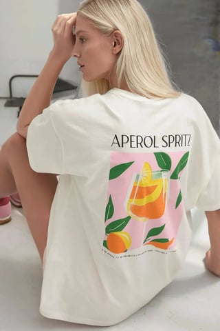 Camiseta de cuello redondo de algodón 100% estampada de corte amplio