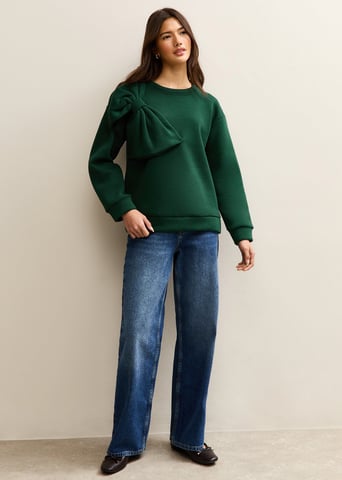 Jersey oversize de color caqui con parche en forma de lazo