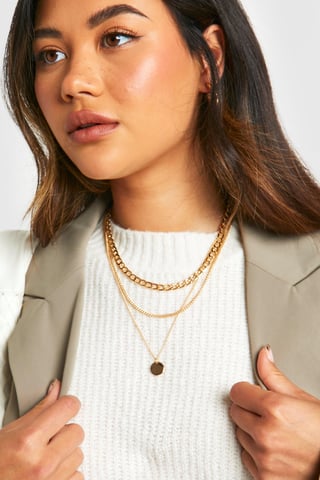 Collar de varias capas con colgante de disco pulido