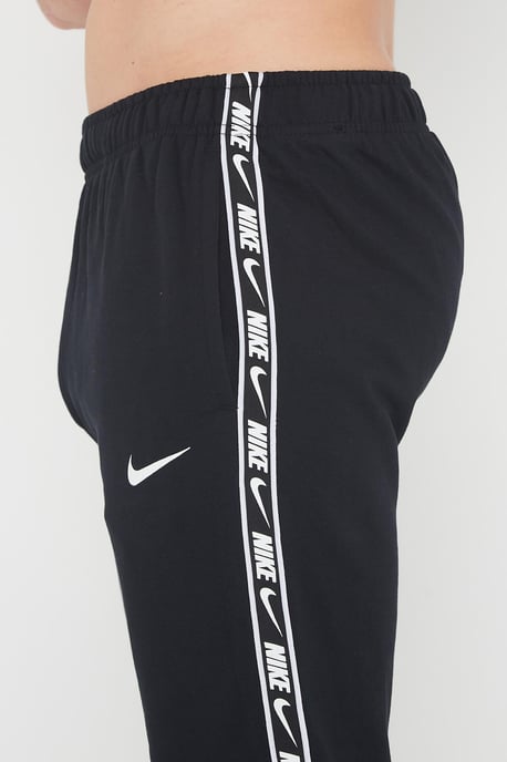 Nike Joggers de polar con puños y logo repetido en negro para hombre - Image 4
