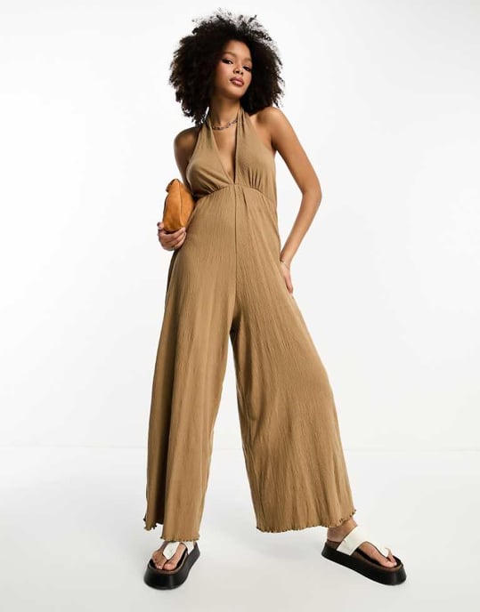 ASOS DESIGN crinkle jersey halter jumpsuit in mocha-Brown
