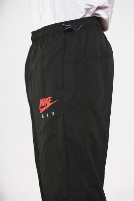 Nike Air Pantalones de chándal tejidos ligeros para hombre Negro - Image 4