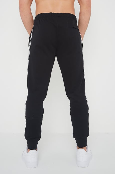 Nike Joggers de polar con puños y logo repetido en negro para hombre - Image 2