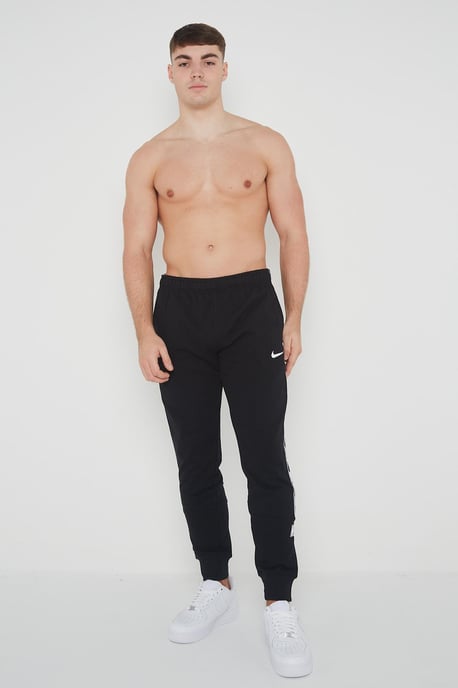 Nike Joggers de polar con puños y logo repetido en negro para hombre - Image 6