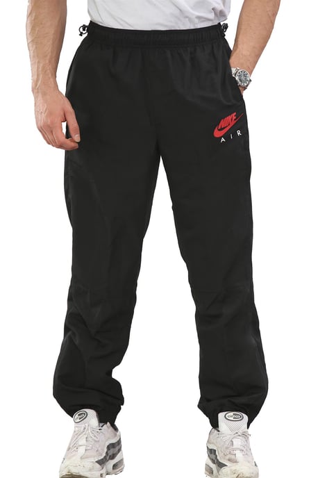 Nike Air Pantalones de chándal tejidos ligeros para hombre Negro - Image 1