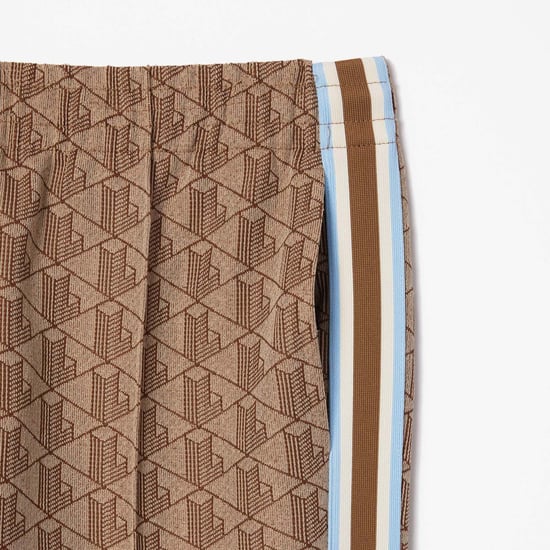 Women's Lacoste Flared Monogram Sweatpants in Beige