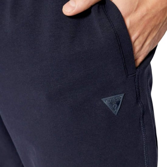 Pantalones de chándal Guess para hombre con el clásico logotipo triangular - Image 3