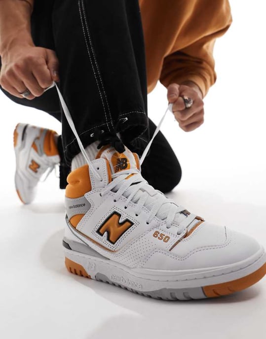New Balance Unisex 650 trainers in white and orange