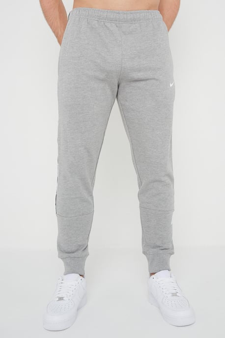 Nike Joggers de polar con puños y logo repetido en gris para hombre - Image 1
