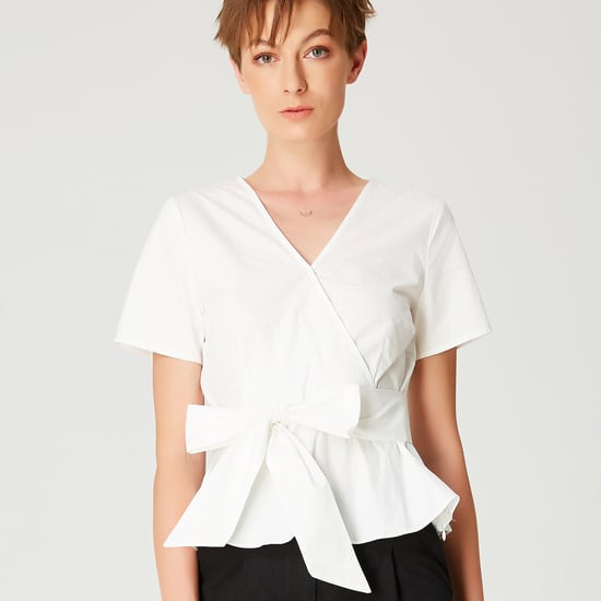 Peplum top with wide bow belt