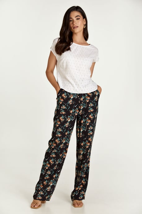 Pantalones anchos con print de flores negros - Image 5