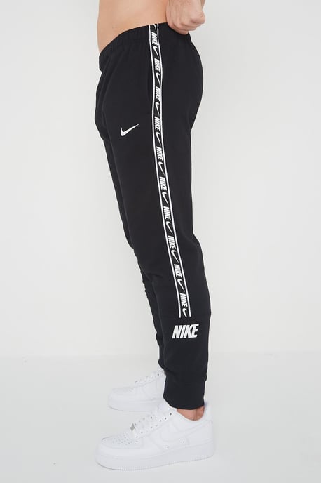 Nike Joggers de polar con puños y logo repetido en negro para hombre - Image 3