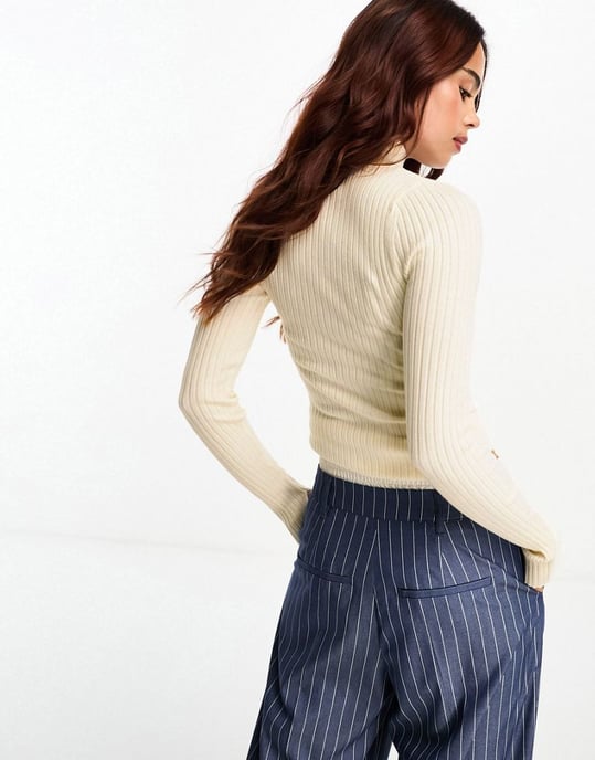 ASOS DESIGN high neck jumper in rib in cream-White