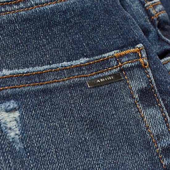 Vaqueros de mezclilla azul clásico con corte slim y corte oblicuo Amiri - Image 4