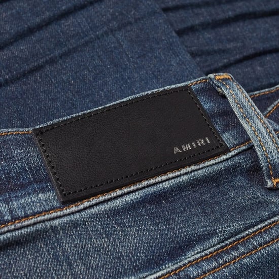 Vaqueros de mezclilla azul clásico con corte slim y corte oblicuo Amiri - Image 5