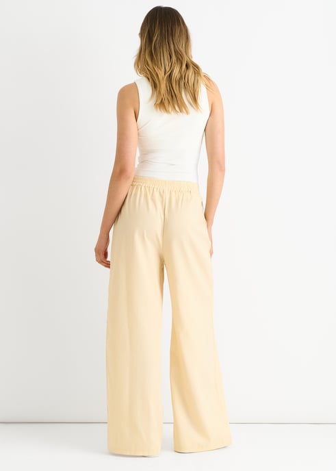 Pantalones de cintura elástica color crema - Image 4