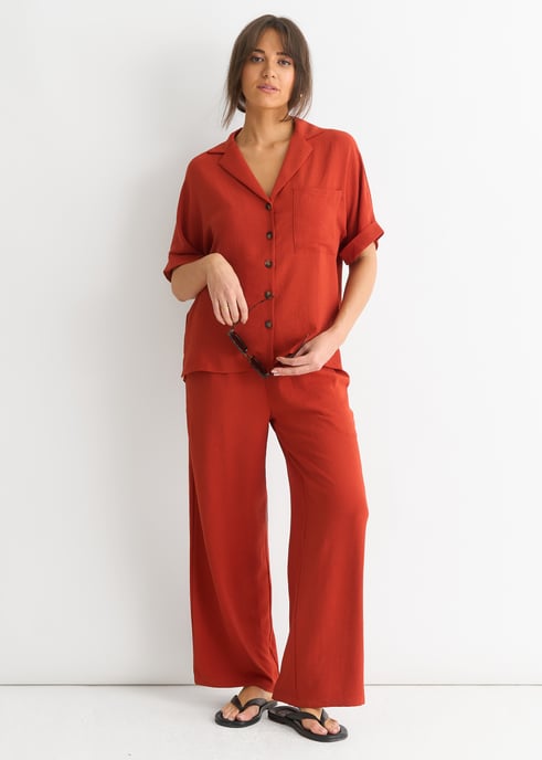 Pantalones de pata ancha con cintura elástica en óxido - Image 1
