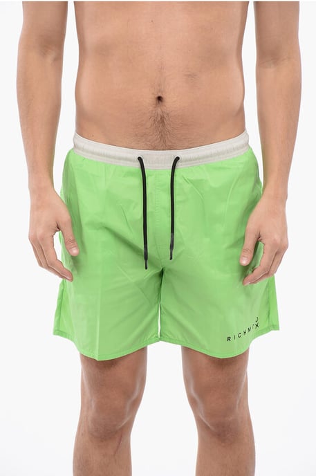 Traje de baño bóxer bicolor en blanco y verde - Image 1