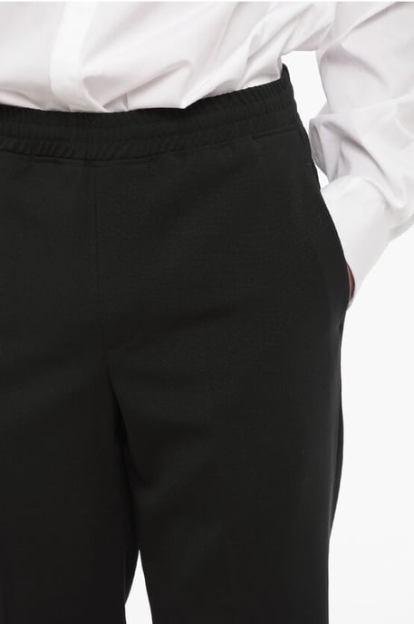 Pantalones casuales ajustados con dobladillo con puños en negro - Image 3