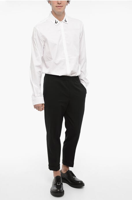 Pantalones casuales ajustados con dobladillo con puños en negro - Image 4