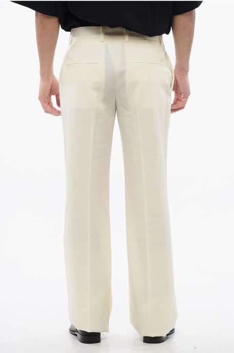 Pantalones acampanados en beige - Image 2