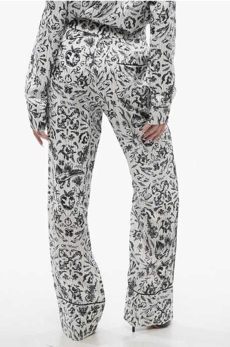Pantalones Palazzo de pijama de satén con estampado de tatuajes en blanco y negro - Image 2