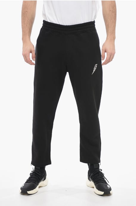 Joggers holgados de mezcla de algodón con cremallera en el tobillo en negro - Image 1