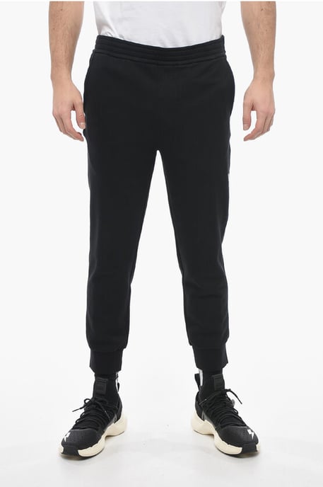 Pantalones deportivos ajustados de algodón con puños en negro - Image 1