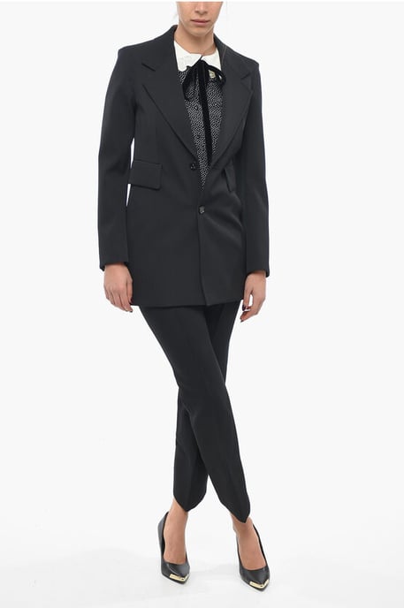 Blazer de lana elástica con mangas curvas en negro - Image 4