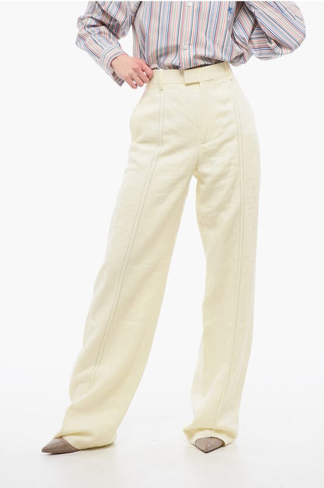Pantalones de lino puro con pinzas delanteras bordadas en amarillo - Image 1