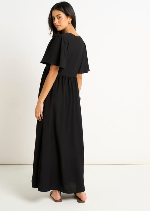Vestido largo skater negro con cuello en V y mangas acampanadas - Image 4