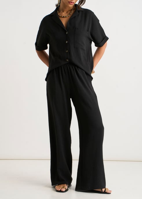 Pantalones negros elásticos de cintura ancha y pierna ancha - Image 1