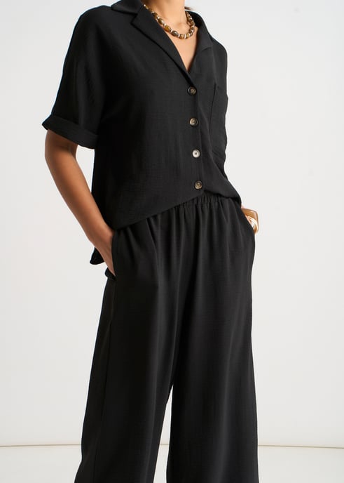 Pantalones negros elásticos de cintura ancha y pierna ancha - Image 3