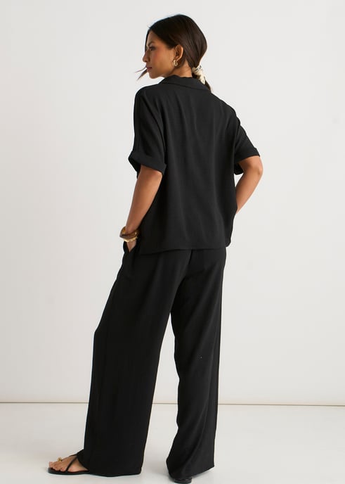 Pantalones negros elásticos de cintura ancha y pierna ancha - Image 4