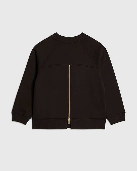 Sudadera negra para niña River Island con detalle de cremallera en la espalda - Image 2