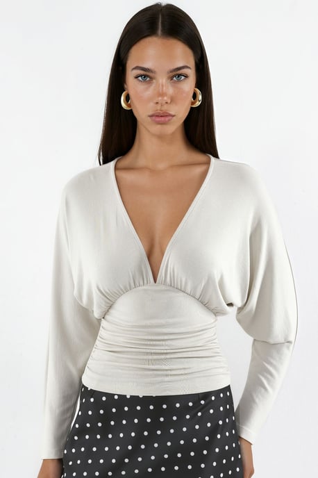Blusa de punto de corte relajado con escote de pico - Image 1